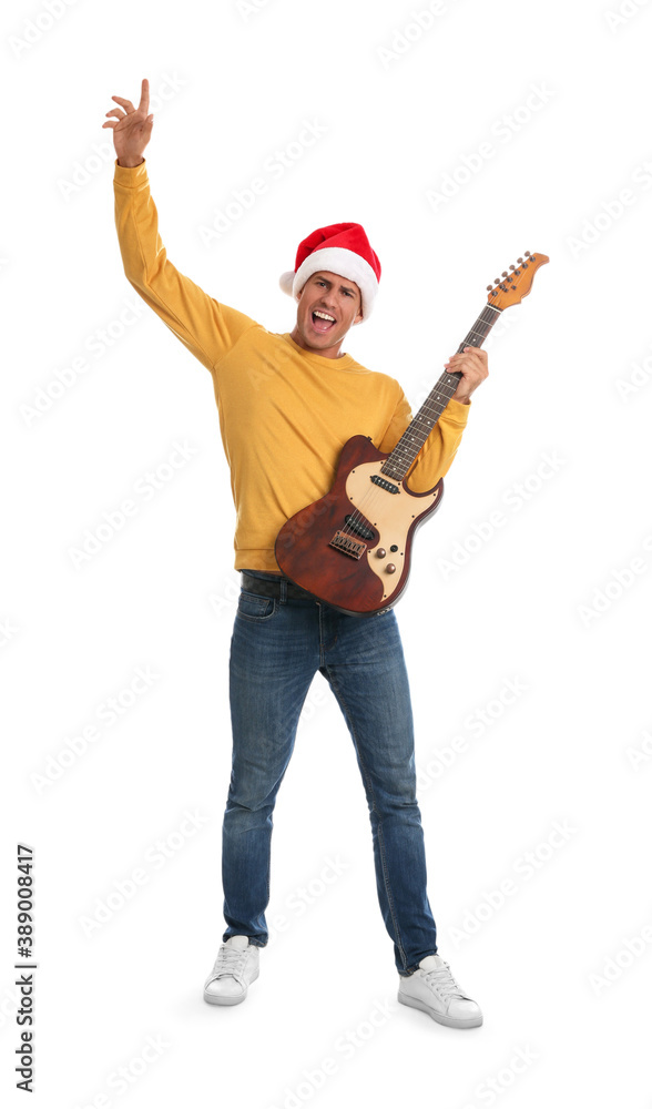 Man in Santa hat with electric guitar on white background. Christmas music Man in Santa hat with electric guitar on white background. Christmas music