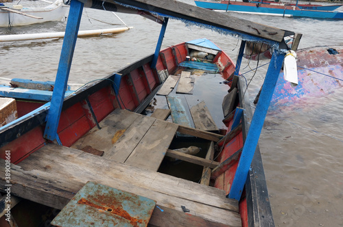 Close-up of broken wooden fishing boat detail on the beach 