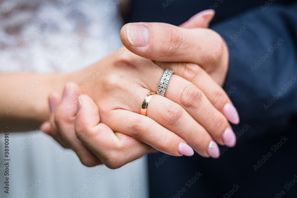 Wedding - bride and groom holding hands