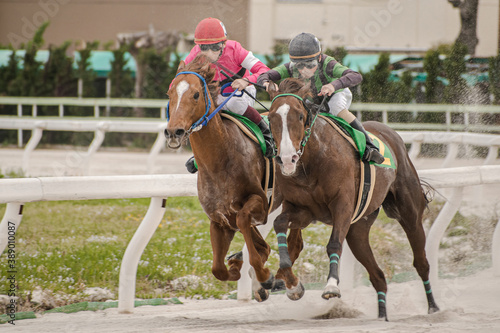 competitive horse racing in heavy sandstorm.
