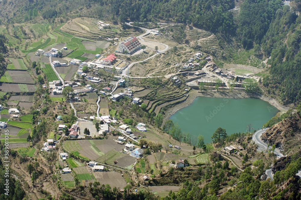 Lake in Himalayas, Indian village near the lake white buildings, Mountain Forest