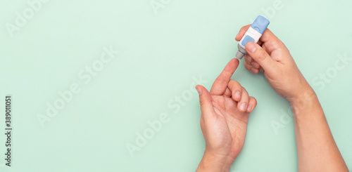 Фототапет Man using lancet for diabetes