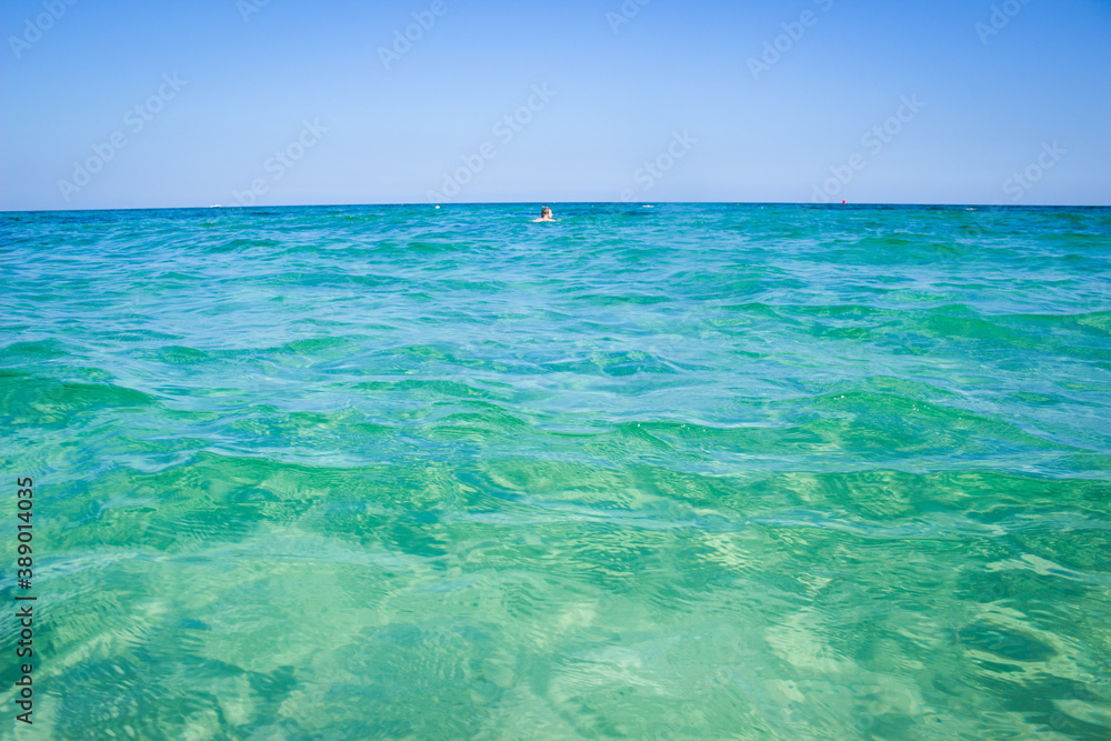 Fototapeta premium Calm sea, blue water, sky and horizon scene in Tunisia.