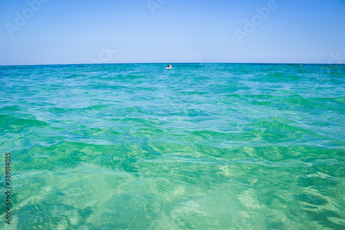 Calm sea, blue water, sky and horizon scene in Tunisia.
