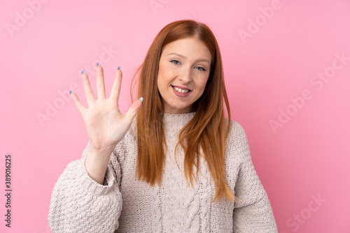 Wallpaper Mural Young redhead woman over isolated pink background counting five with fingers Torontodigital.ca