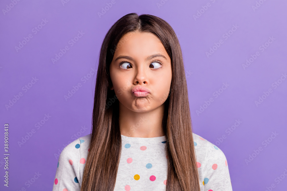 Naklejka premium Photo portrait of silly girl grimacing looking at nose pouting isolated on vivid violet colored background