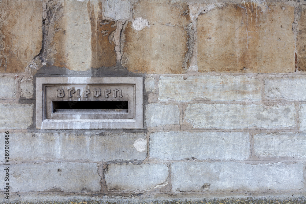 Old stone mailbox in the centre of Bruges, copy space right (Translation: Brieven means Letters) Old stone mailbox in the centre of Bruges, copy space right (Translation: Brieven means Letters)
