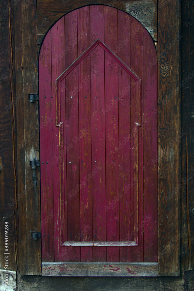 Deep purple arched door made of wood