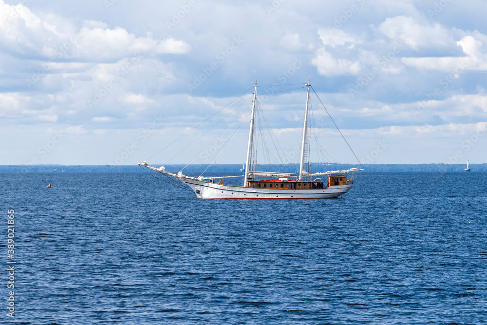 Fototapeta premium Old ship with two masts with lowered sails