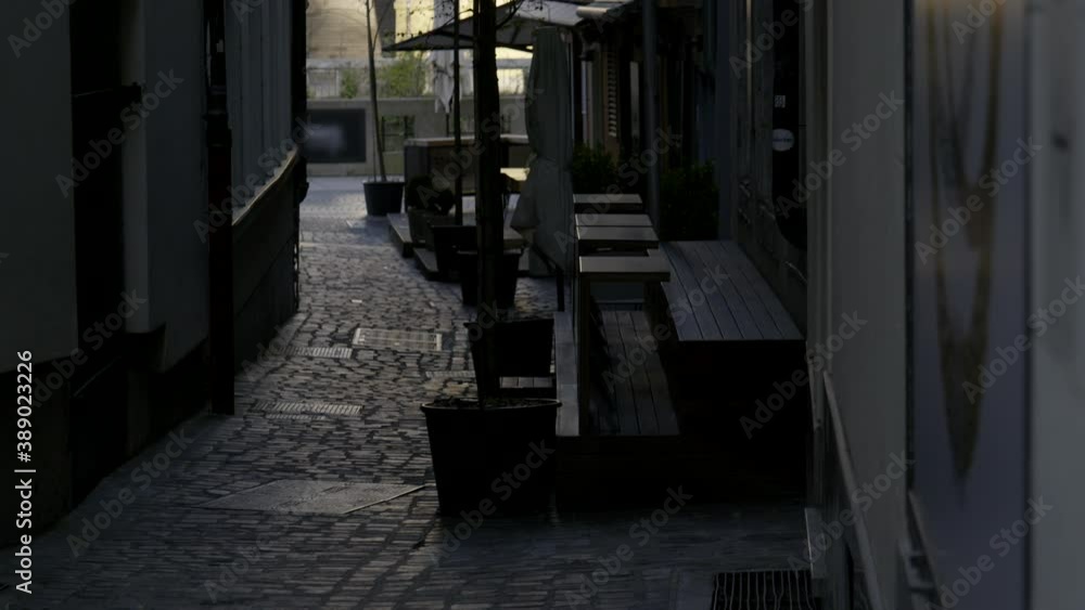 Empty bar tables and chairs closed as a result of a coronavirus quarantine. Bars and restaurants in Ljubljana are closed due to covid-19 epidemic. Empty bar tables and chairs closed as a result of a coronavirus quarantine. Bars and restaurants in Ljubljana are closed due to covid-19 epidemic.