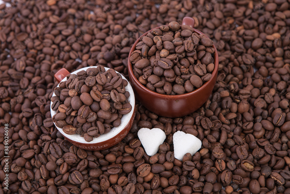 Fototapeta premium Cup of coffee on the coffee beans background