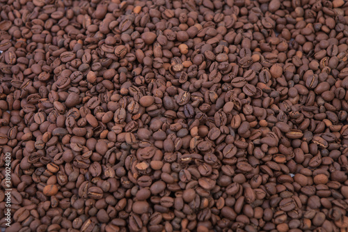 Cup of coffee on the coffee beans background