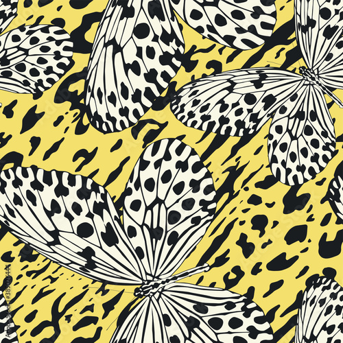 Seamless vector multicolor butterflies pattern. Butterfly on leopard print. Trendy animal motif wallpaper. Fashionable background for fabric  textile  design  banner  cover  web etc.