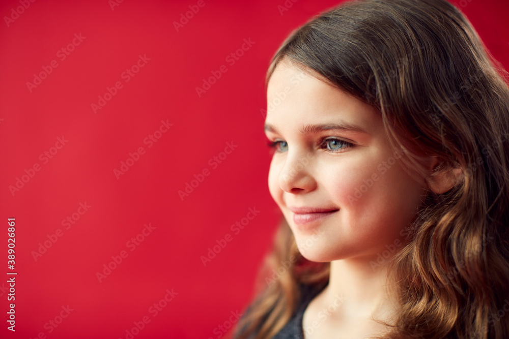 Portrait Of Girl Against Red Studio Background Smiling At Camera Portrait Of Girl Against Red Studio Background Smiling At Camera