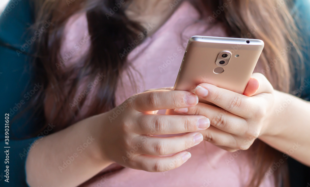 Woman using smartphone for work or fun Woman using smartphone for work or fun
