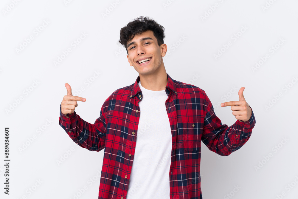 Young Argentinian man over isolated white background proud and self-satisfied Young Argentinian man over isolated white background proud and self-satisfied