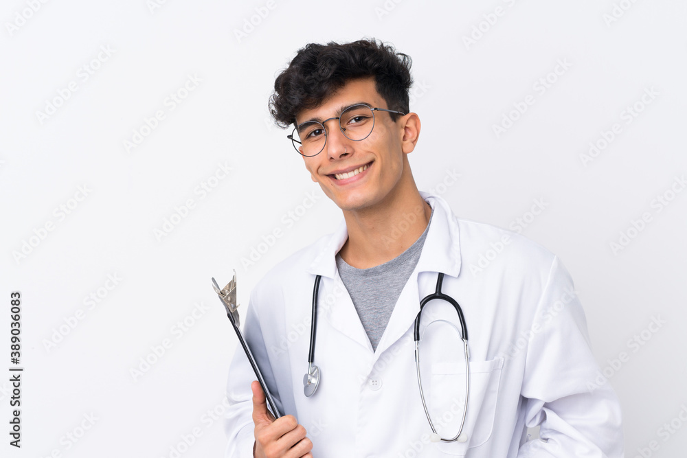 Young Argentinian man over isolated white background wearing a doctor gown and holding a folder Young Argentinian man over isolated white background wearing a doctor gown and holding a folder