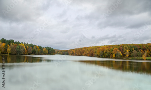 Autumn landscape with colorful forest and a lake