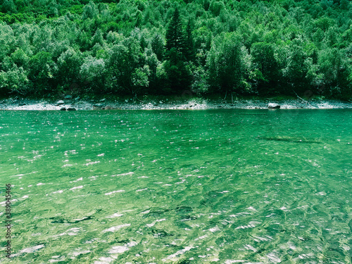 A small transparent lake high in the mountains.