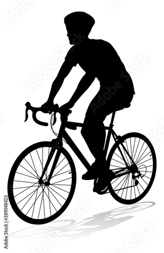 Bicyclist riding their bike and wearing a safety helmet in silhouette