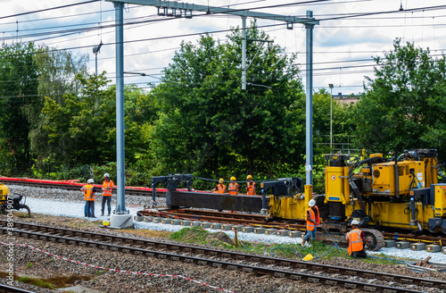 Workers on a large railroad construction project
