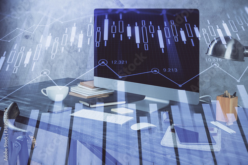 Financial chart drawing and table with computer on background. Double exposure. Concept of international markets. © peshkova