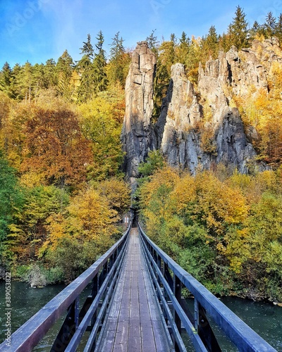 Wooden bridge over the river Ohre and sandstone rocks nearby from Karlovy Vary