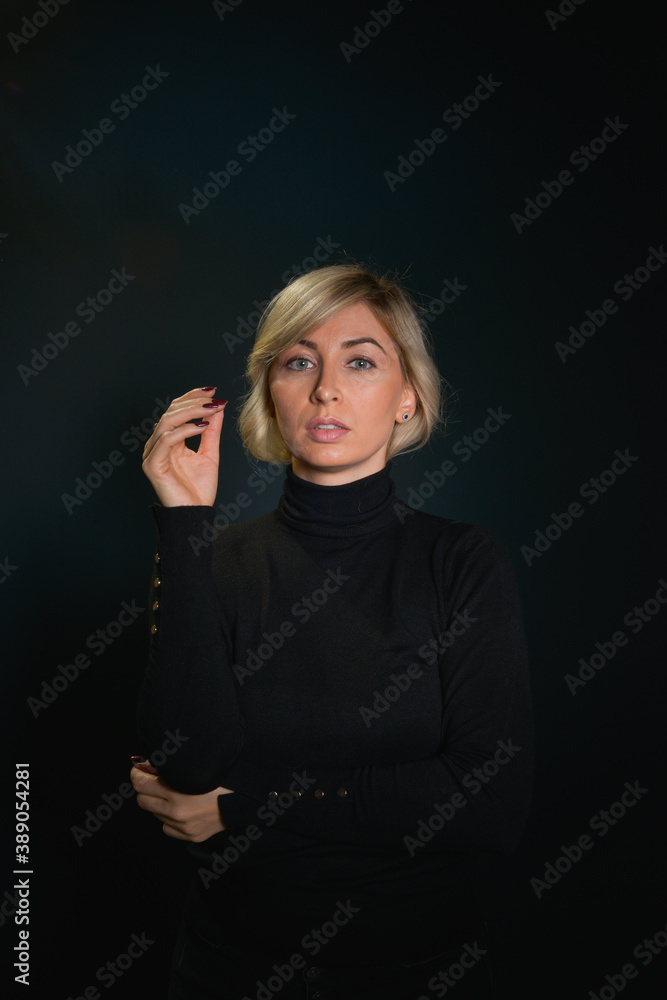 Beautiful young blonde woman with blue eyes isolated on back Beautiful young blonde woman with blue eyes isolated on back
