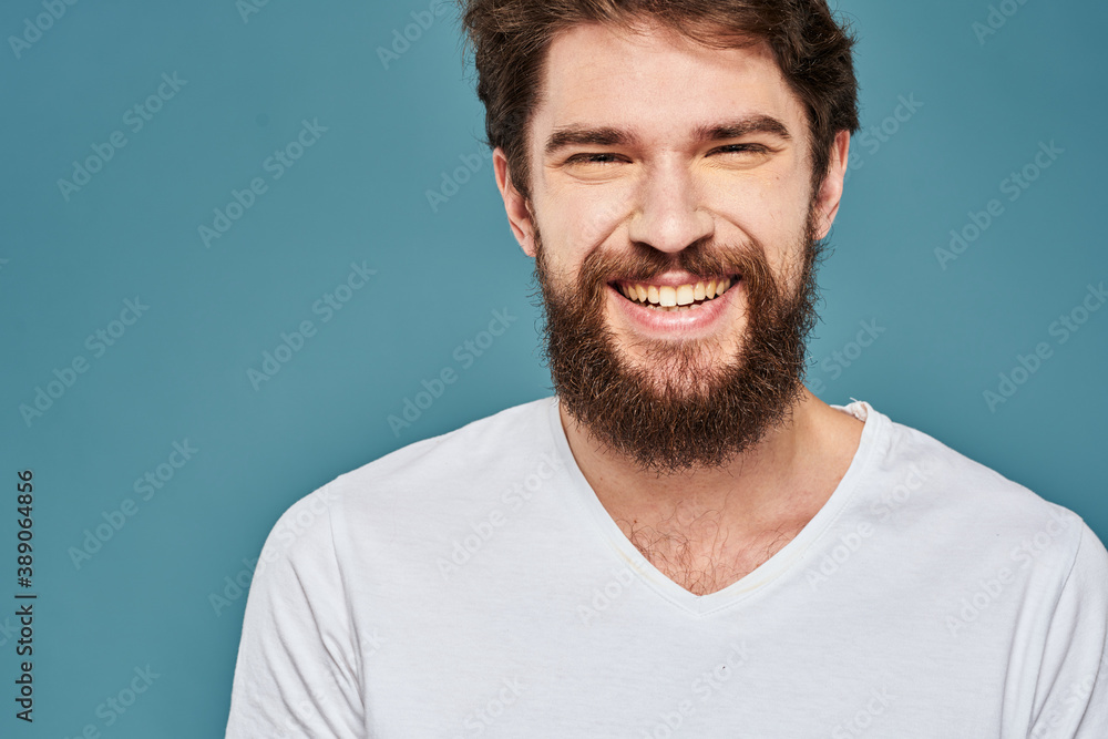 emotional man gesturing with hands lifestyle fun white t-shirt blue isolated stock emotional man gesturing with hands lifestyle fun white t-shirt blue isolated stock
