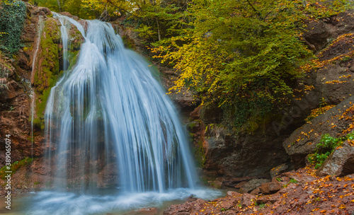 closeup huge waterfall on a mountain river