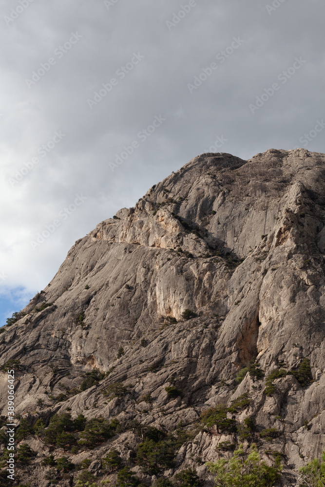 The top of the mountain against the background of clouds