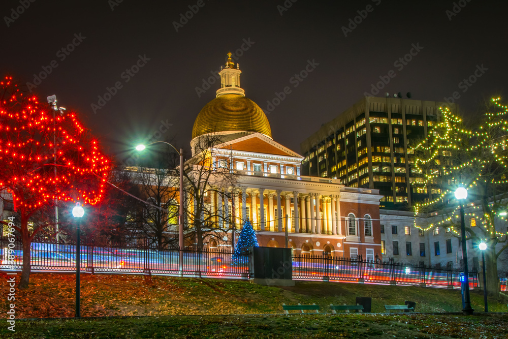 Christmas lights decorate the trees in front of the Massachusetts State House