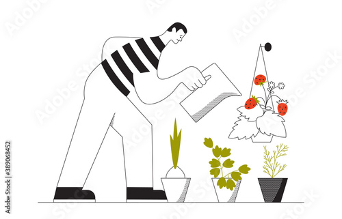 Man watering vegetables grown at home