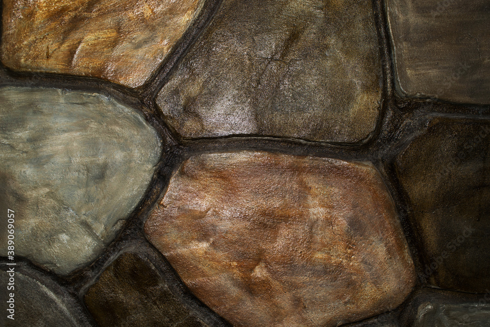 A wall of stones. View of the facing stones. Background of stones A wall of stones. View of the facing stones. Background of stones