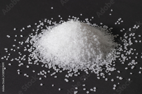Heap of coarse salt on darck background