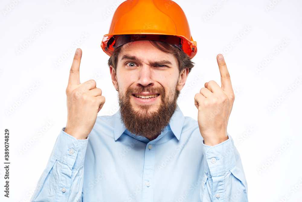 emotional man in work uniform gesturing with his hands an official construction professional