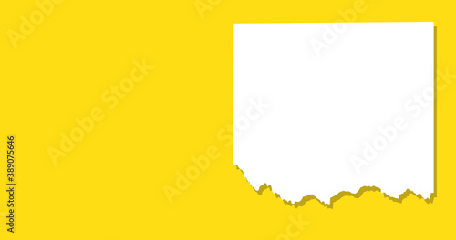 Torn Piece of Paper on a Yellow Backgroudn with Room for Copy