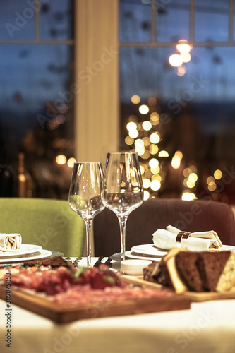 Nicely served New Year s table in the restaurant. Christmas night in a cafe or at home. Stock photo for design