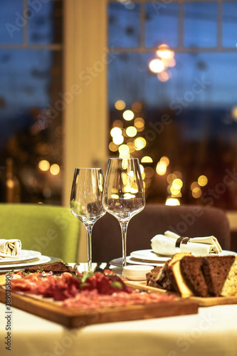 Nicely served New Year s table in the restaurant. Christmas night in a cafe or at home. Stock photo for design