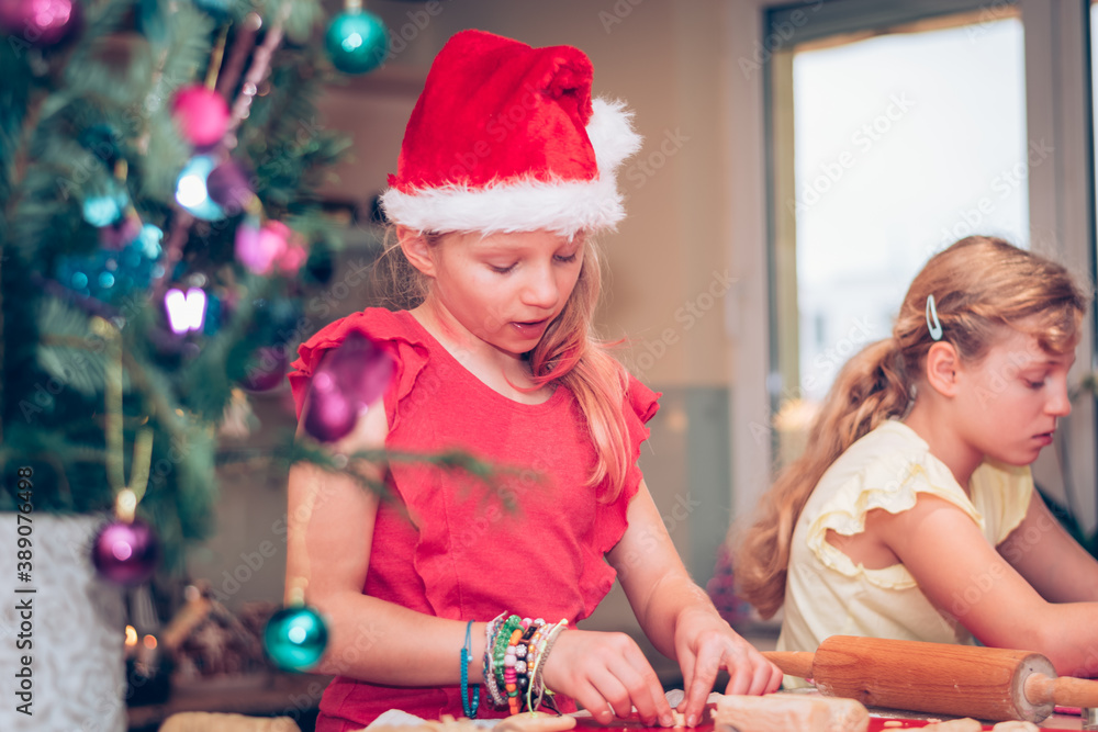 christmas concept with children preparing christmas sweets in the kitchen and colorful festive christmas decoration christmas concept with children preparing christmas sweets in the kitchen and colorful festive christmas decoration