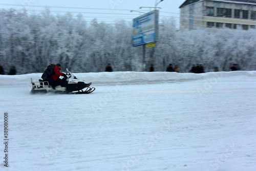 Sports competitions in the North of Russia Snowmobiling on the road. The City Of Vorkuta