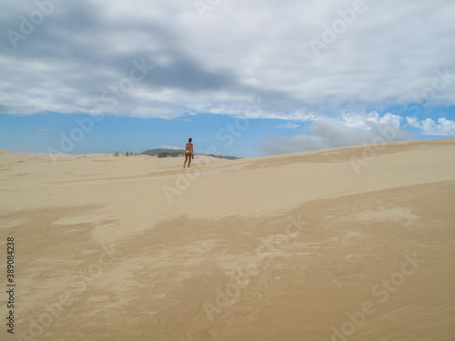 person walking on the dunes