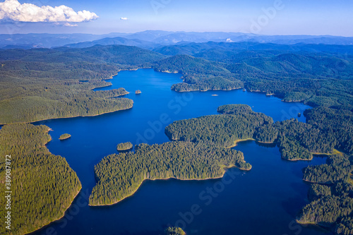 Amazing aerial view at Dam Shiroka Poliana, Bulgaria,  Beautiful panorama of bluewater and green forest. photo