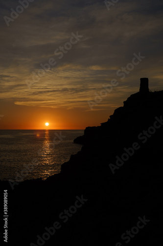 Beautiful sunset by the sea at the lighthouse of Cala Figuera, Mallorca, Spain