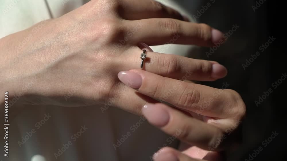 Woman bride holding proposal marriage wedding ring in hands. Woman bride holding proposal marriage wedding ring in hands.