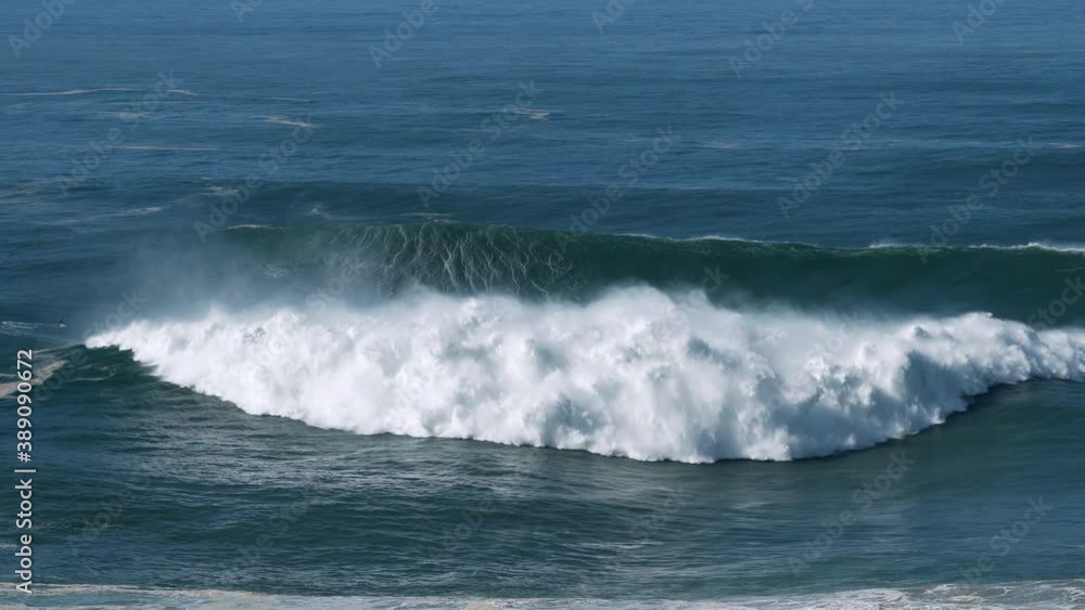 Giant ocean waves in Nazare, Leiria District, Portugal. Nazare is famously known to surfers for having the largest waves in the world. Giant ocean waves in Nazare, Leiria District, Portugal. Nazare is famously known to surfers for having the largest waves in the world.