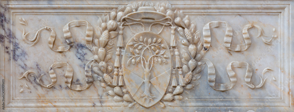 ROME, ITALY - MARCH 9, 2016: The marble relief wihth the coat of arms of a cardinal  in church Basilica di Santa Maria del Popolo.