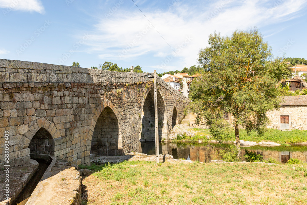 medieval bridge over Varosa river in Ucanha village, municipality of Tarouca, district of Viseu, Portugal 