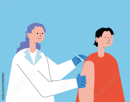 female doctor with patient injecting vaccine