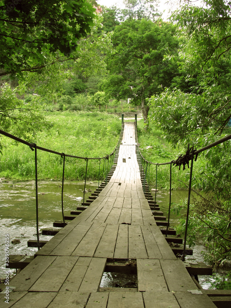 Obraz premium wooden bridge over the river